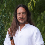 Portrait of musician John Dumas providing a testimonial for Steven Von Linne's website.